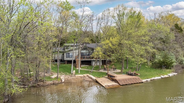 dock with a lawn and a deck with water view