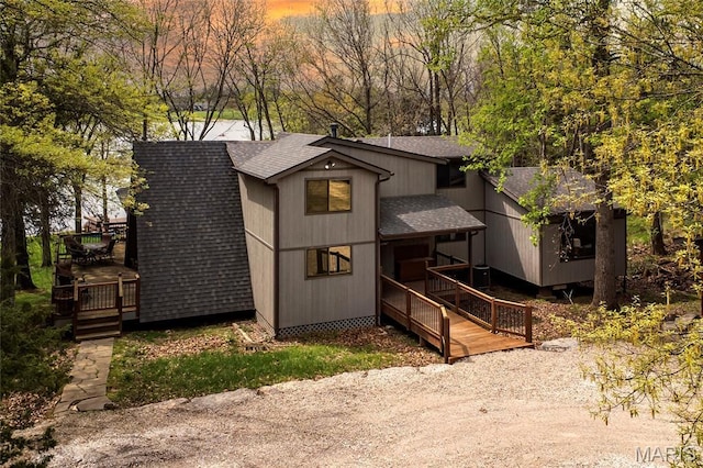 803 S Aspen Point Dr, Innsbrook, MO 63390 - view of front of home with a shingled roof and a wooden deck