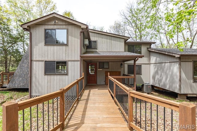 803 S Aspen Point Dr, Innsbrook, MO 63390 - rear view of house with roof with shingles and cooling unit