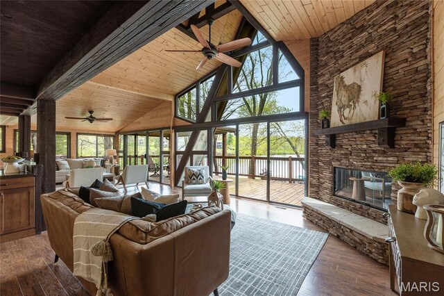 803 S Aspen Point Dr, Innsbrook, MO 63390 - living area with a ceiling fan, wood ceiling with exposed beams, high vaulted ceiling, plenty of natural light, and wood-type flooring