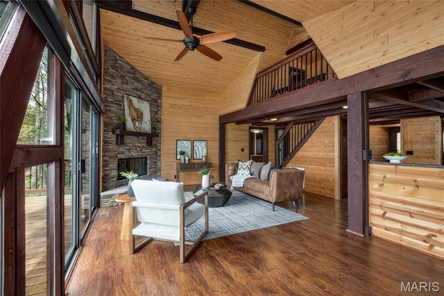 803 S Aspen Point Dr, Innsbrook, MO 63390 - living room with high vaulted ceiling, ceiling fan, wooden ceiling with exposed beams, an outdoor stone fireplace, and wood finished floors