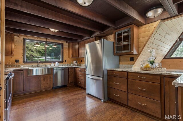 803 S Aspen Point Dr, Innsbrook, MO 63390 - kitchen featuring appliances with stainless steel finishes, beam ceiling, a sink, light stone countertops, and dark wood finished floors