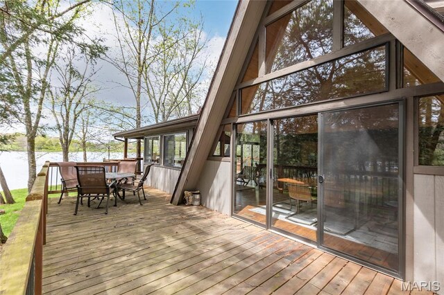 803 S Aspen Point Dr, Innsbrook, MO 63390 - wooden deck with a water view and outdoor dining area