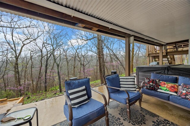 4650 Demaree St, House Springs, MO 63051 - view of patio / terrace featuring a hot tub and a view of trees