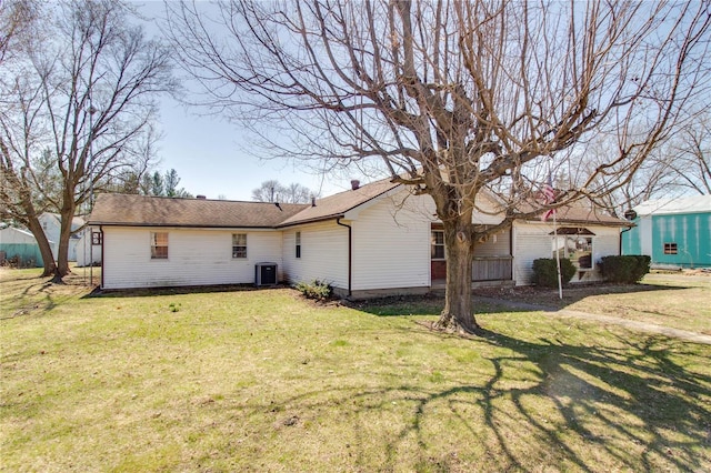 239 Olive St, Rockbridge, IL 62081 - back of property with central air condition unit and a yard