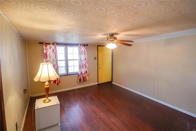 239 Olive St, Rockbridge, IL 62081 - empty room featuring an ornate ceiling, dark wood-style floors, a ceiling fan, and baseboards