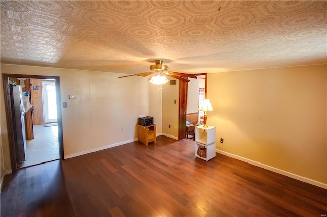 239 Olive St, Rockbridge, IL 62081 - empty room featuring an ornate ceiling, wood finished floors, baseboards, and ceiling fan