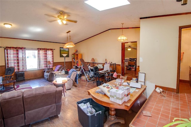 239 Olive St, Rockbridge, IL 62081 - living area with a ceiling fan, crown molding, lofted ceiling, a wainscoted wall, and wood finished floors
