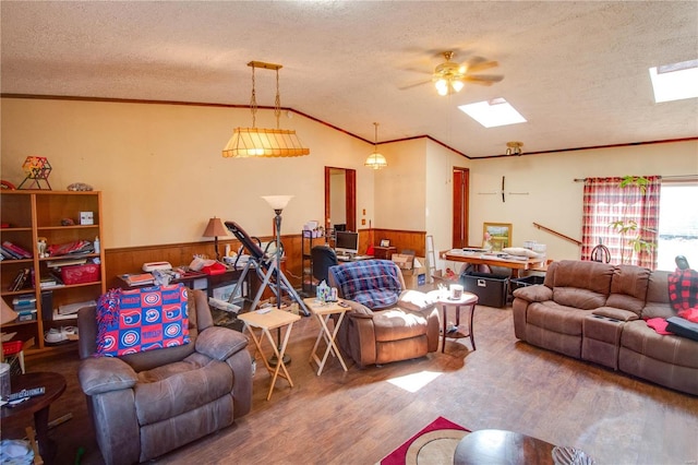 239 Olive St, Rockbridge, IL 62081 - living room with wood finished floors, a textured ceiling, a wainscoted wall, crown molding, and a skylight