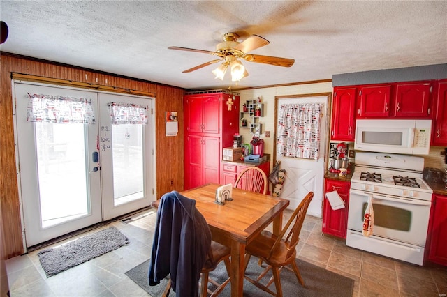 239 Olive St, Rockbridge, IL 62081 - dining space featuring wooden walls, a ceiling fan, a textured ceiling, and french doors