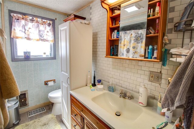 239 Olive St, Rockbridge, IL 62081 - bathroom with toilet, tile walls, a shower with curtain, vanity, and decorative backsplash