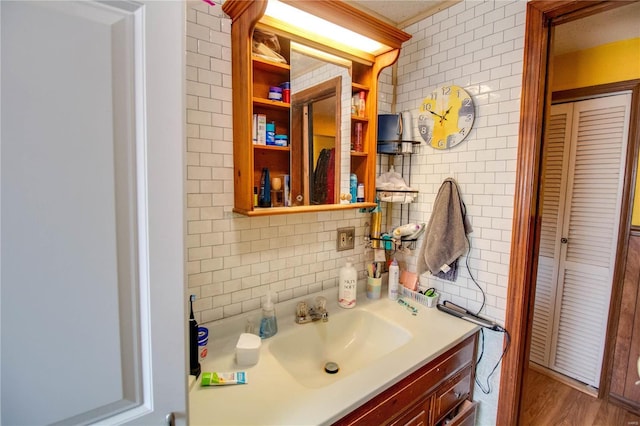 239 Olive St, Rockbridge, IL 62081 - bathroom featuring tile walls, decorative backsplash, and vanity