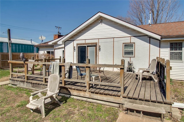 239 Olive St, Rockbridge, IL 62081 - back of house with a wooden deck, fence, outdoor dining area, and a shingled roof