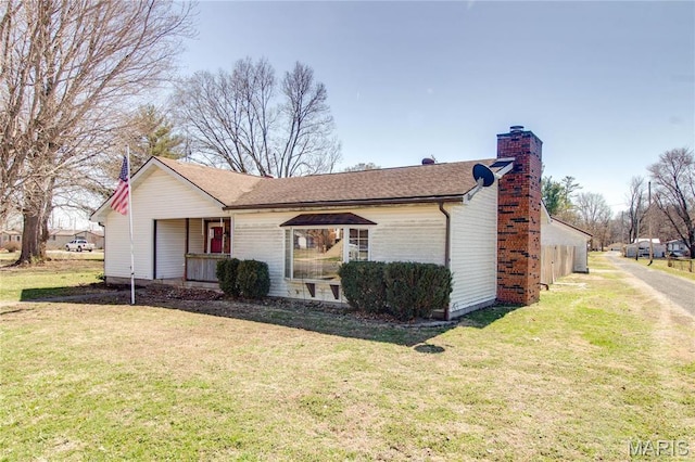 239 Olive St, Rockbridge, IL 62081 - view of side of home featuring a yard, covered porch, and a chimney