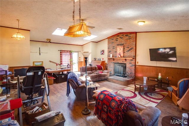 239 Olive St, Rockbridge, IL 62081 - living room with ornamental molding, a wainscoted wall, wood finished floors, a textured ceiling, and vaulted ceiling