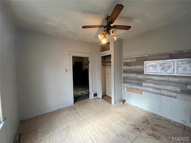 5052 Plover Ave, Saint Louis, MO 63120 - unfurnished bedroom featuring a ceiling fan and a closet