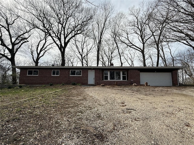 1227 Teson Rd, Hazelwood, MO 63042 - single story home with brick siding, an attached garage, and driveway