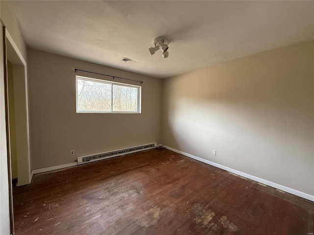 1227 Teson Rd, Hazelwood, MO 63042 - unfurnished room with a baseboard radiator, wood finished floors, and baseboards
