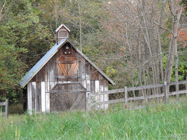 3921 Allenton Rd, Wildwood, MO 63069 - view of barn with fence and a forest view