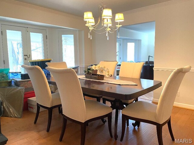 3921 Allenton Rd, Wildwood, MO 63069 - dining space featuring crown molding, light wood-style flooring, a chandelier, and plenty of natural light