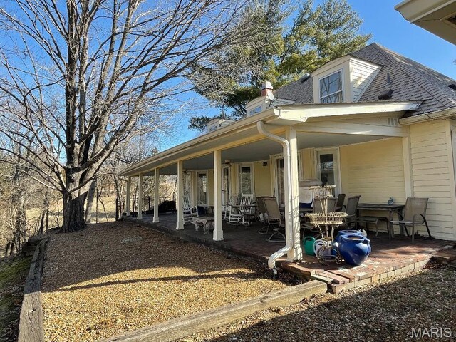 3921 Allenton Rd, Wildwood, MO 63069 - view of side of property featuring a patio and a chimney