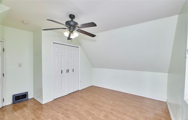 7048 Raymond Ave, Saint Louis, MO 63130 - additional living space with light wood-style floors, ceiling fan, baseboards, and lofted ceiling
