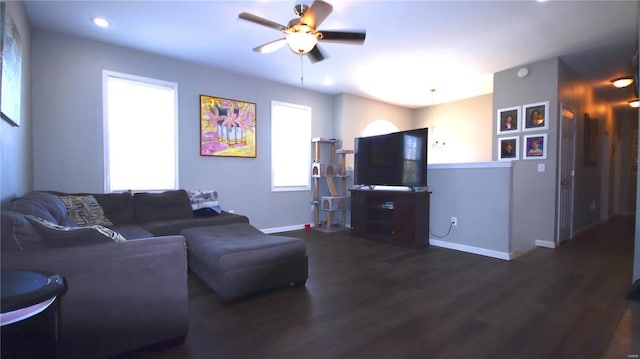 living area with wood finished floors, baseboards, a ceiling fan, and recessed lighting