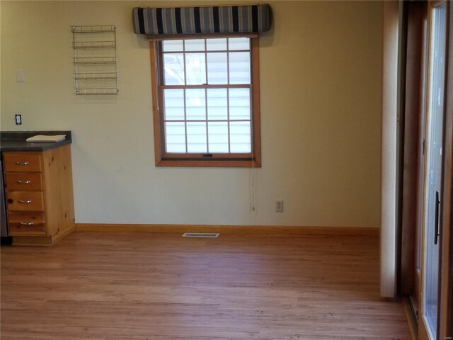 8774 E Chinquapin Ave E, Effingham, IL 62401 - unfurnished bedroom featuring wood finished floors and baseboards