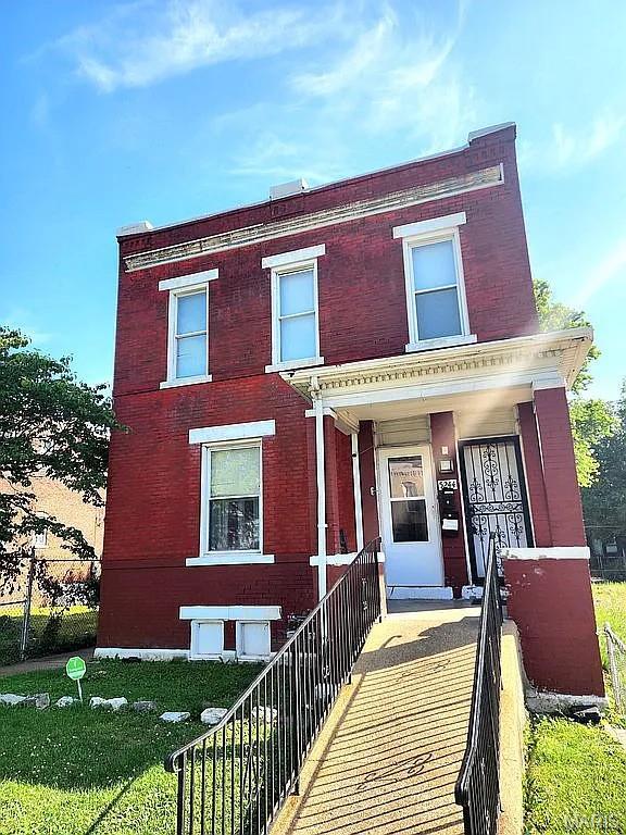 5244 Theodosia Ave, Saint Louis, MO 63113 - view of front of house featuring brick siding and a porch