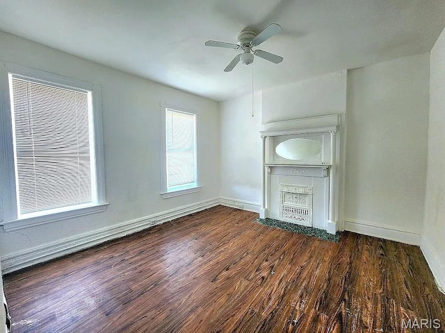 5244 Theodosia Ave, Saint Louis, MO 63113 - unfurnished living room featuring ceiling fan, wood finished floors, and baseboards