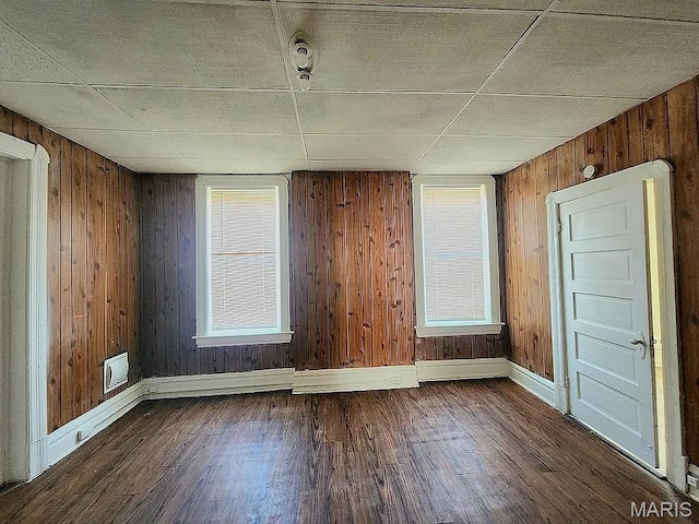 5244 Theodosia Ave, Saint Louis, MO 63113 - unfurnished room with dark wood finished floors, baseboards, and wooden walls