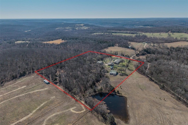 20677 Bend Rd, Crocker, MO 65452 - aerial view of sparsely populated area featuring property boundaries highlighted, a heavily wooded area, and a large body of water