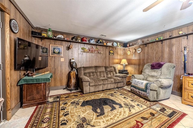 20677 Bend Rd, Crocker, MO 65452 - living room featuring wood walls, light tile patterned flooring, and a ceiling fan