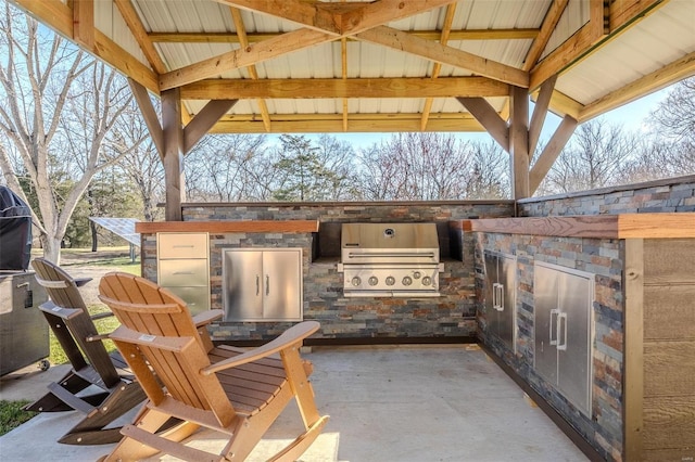 20677 Bend Rd, Crocker, MO 65452 - view of patio featuring a grill, area for grilling, and a gazebo
