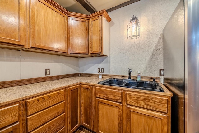 20677 Bend Rd, Crocker, MO 65452 - kitchen with a sink, brown cabinetry, freestanding refrigerator, and light countertops