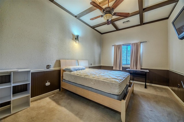 20677 Bend Rd, Crocker, MO 65452 - carpeted bedroom featuring wainscoting, wooden walls, a textured wall, and a ceiling fan