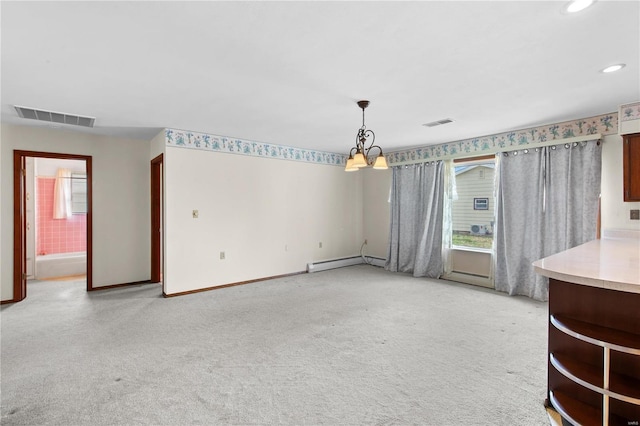 unfurnished living room featuring a baseboard radiator, light carpet, healthy amount of natural light, and recessed lighting