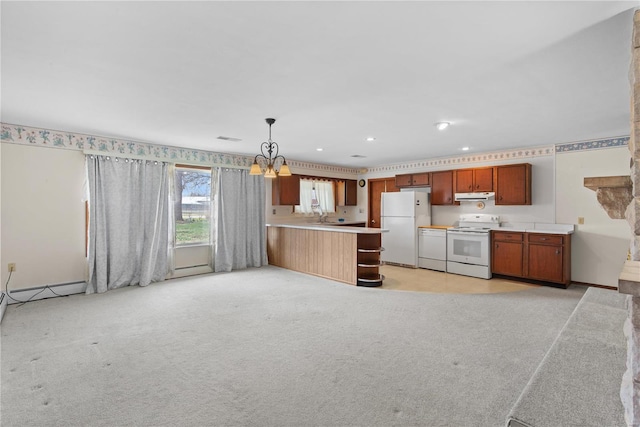 kitchen featuring white appliances, under cabinet range hood, a peninsula, light countertops, and recessed lighting
