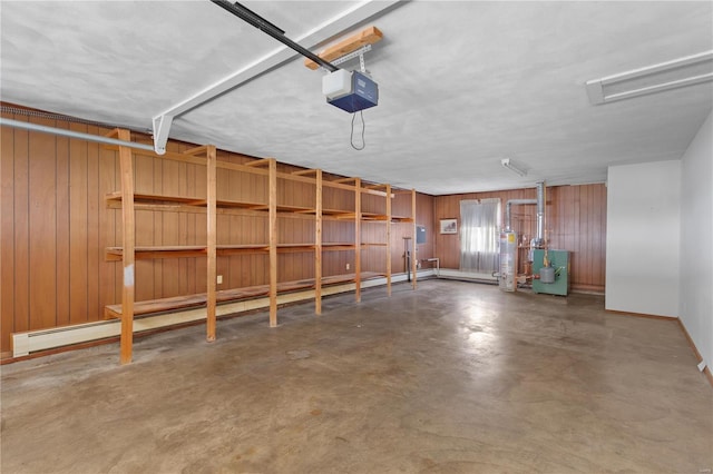 garage featuring a garage door opener, gas water heater, wooden walls, and baseboards