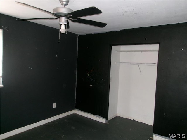 26 Victoria Dr, Pontoon Beach, IL 62040 - unfurnished bedroom featuring concrete flooring, a closet, baseboards, and ceiling fan