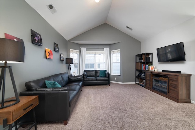 living area with vaulted ceiling, carpet, and baseboards