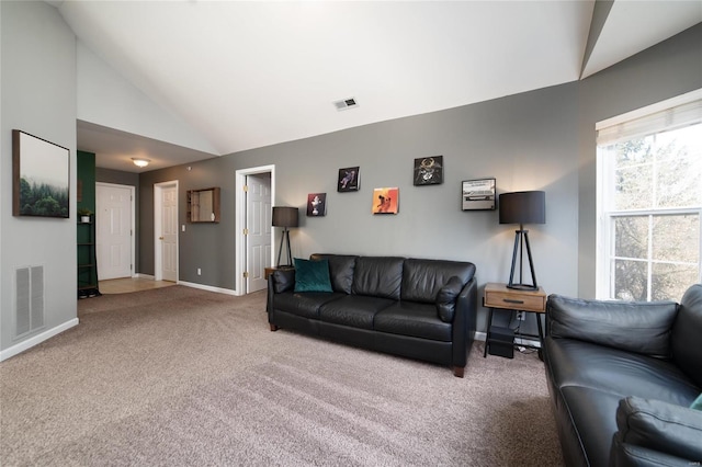 carpeted living area featuring lofted ceiling and baseboards