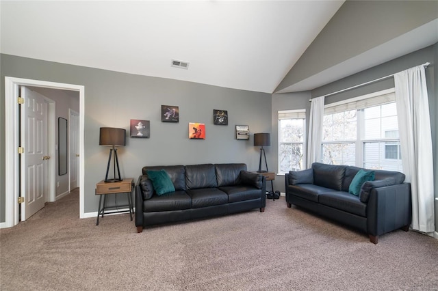 living room featuring light colored carpet, vaulted ceiling, and baseboards