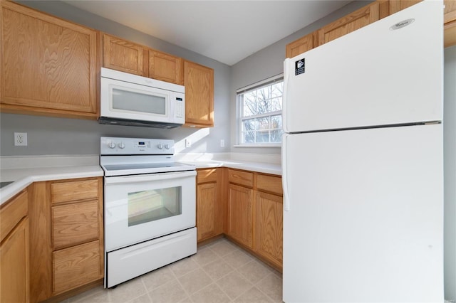 kitchen with white appliances and light countertops