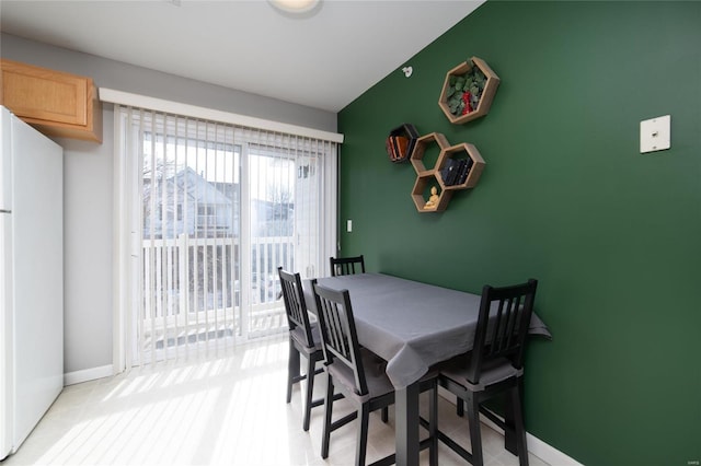 dining space with baseboards