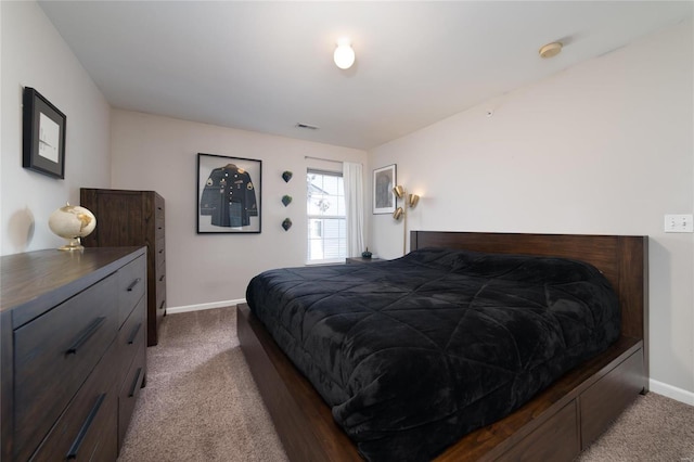 carpeted bedroom with baseboards