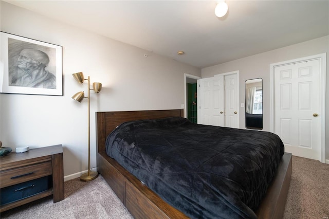 carpeted bedroom with baseboards