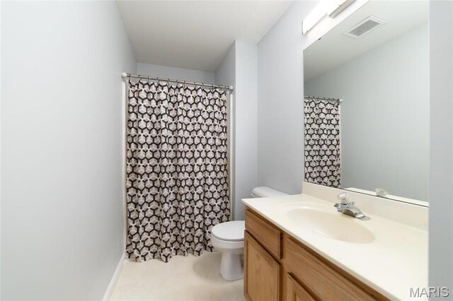 420 Benton Dr Unit I, Saint Peters, MO 63376 - bathroom featuring vanity, toilet, and a shower with shower curtain