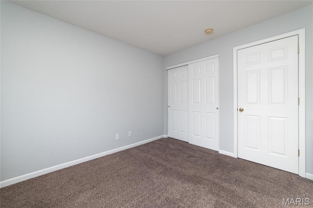 420 Benton Dr Unit I, Saint Peters, MO 63376 - unfurnished bedroom featuring dark colored carpet, baseboards, and a closet