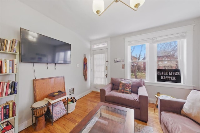 5044 Lindenwood Ave, Saint Louis, MO 63109 - living room featuring wood finished floors, healthy amount of natural light, and baseboards